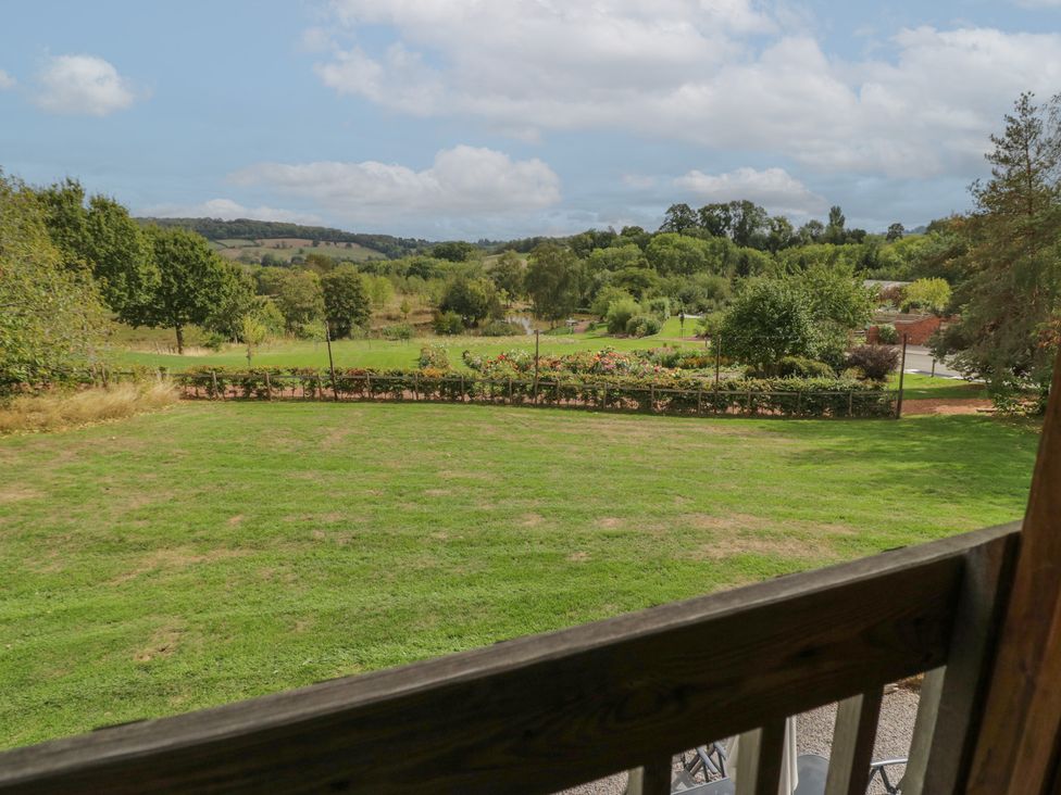 A garden with trees and flowers at Kingfisher in Worcester