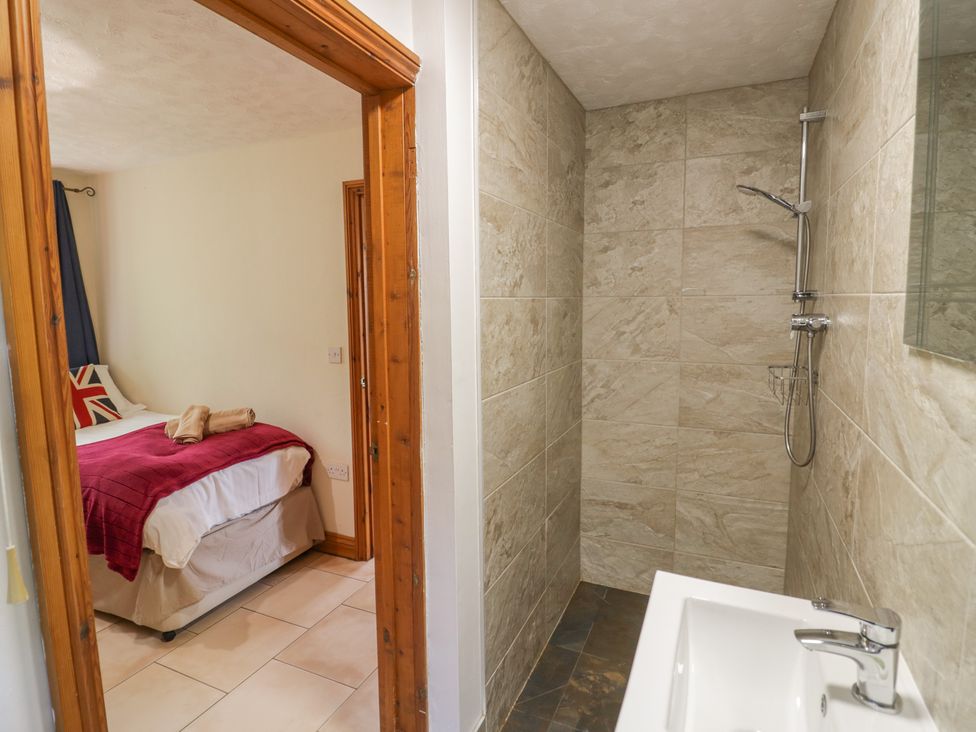 A bathroom with a shower and sink at Kingfisher in Worcester
