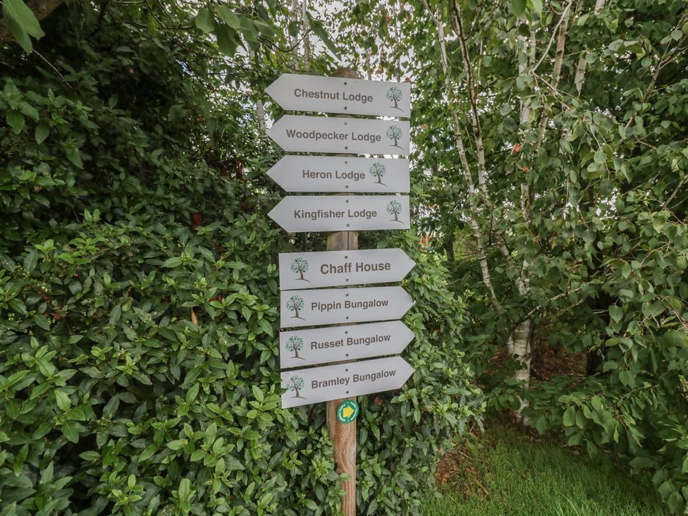 A signpost showing directions to various lodges at Kingfisher in Worcester