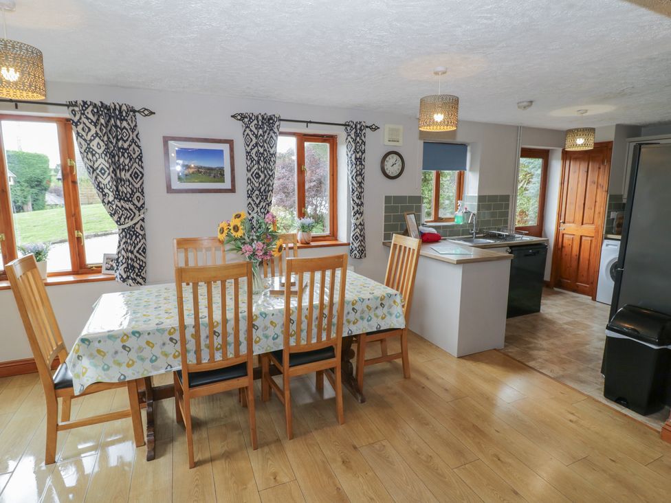 A kitchen with dining table and chairs at Heron in Worcester