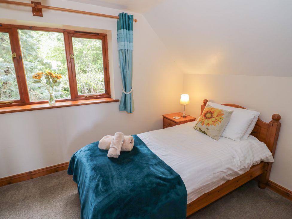 A bedroom with a bed and window at Heron in Worcester