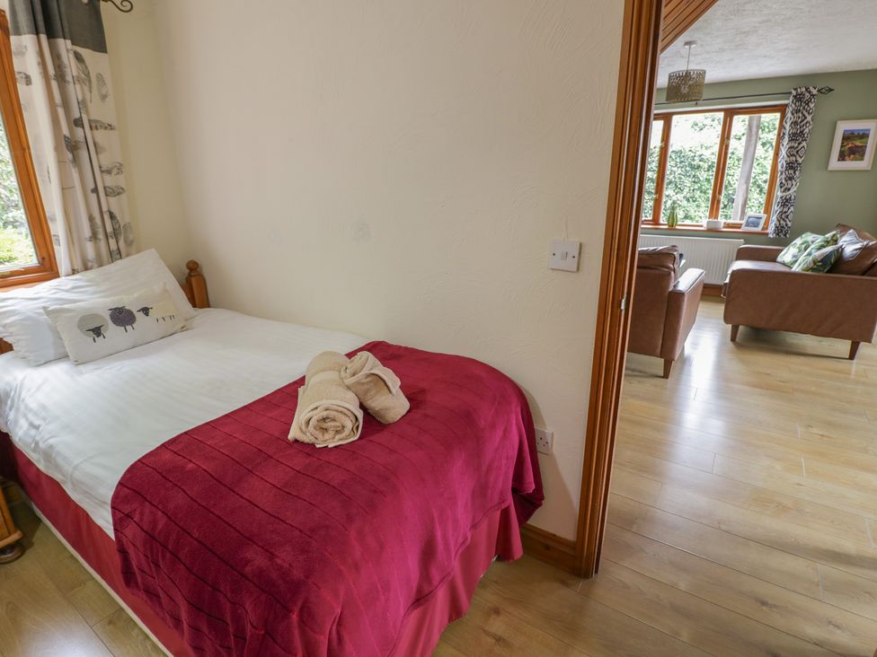 A bedroom with a bed and a window at Heron in Worcester