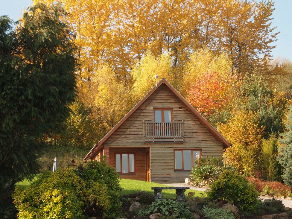 A house with a balcony and garden at Woodpecker in Worcester