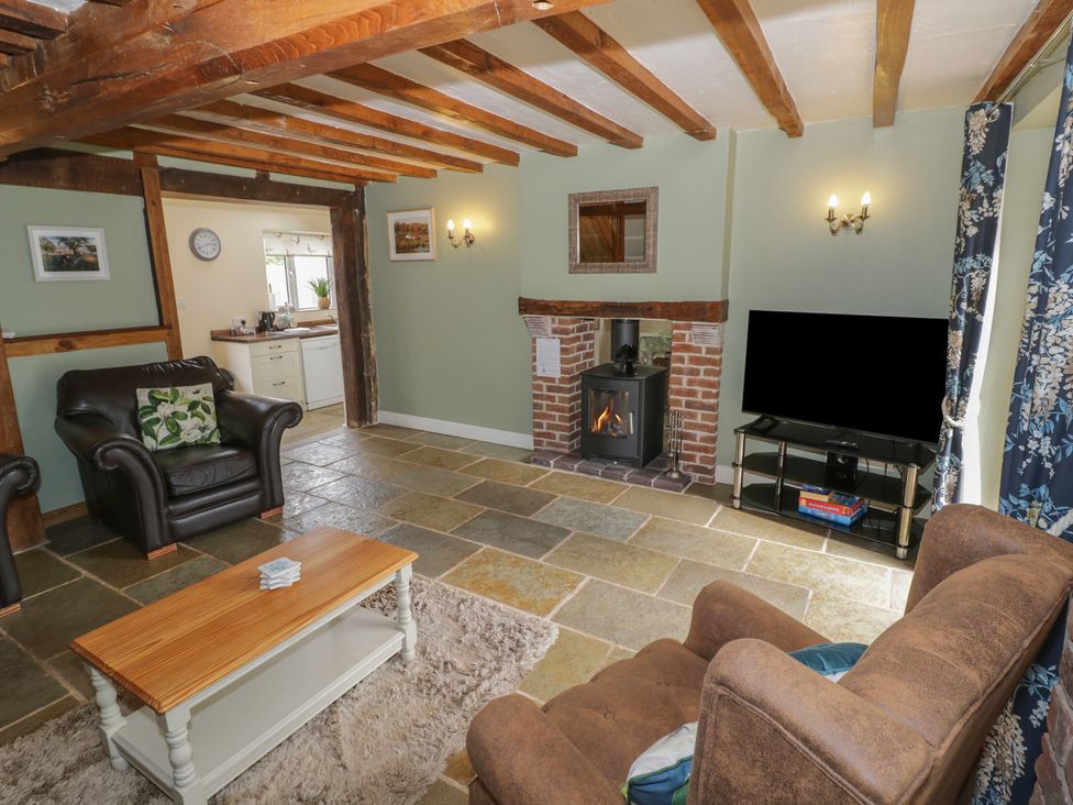 A living room with a sofa and TV at Chaff House in Worcester