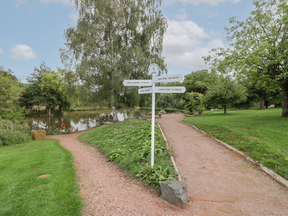 A signpost with distance markers in a park at Chaff House Worcester