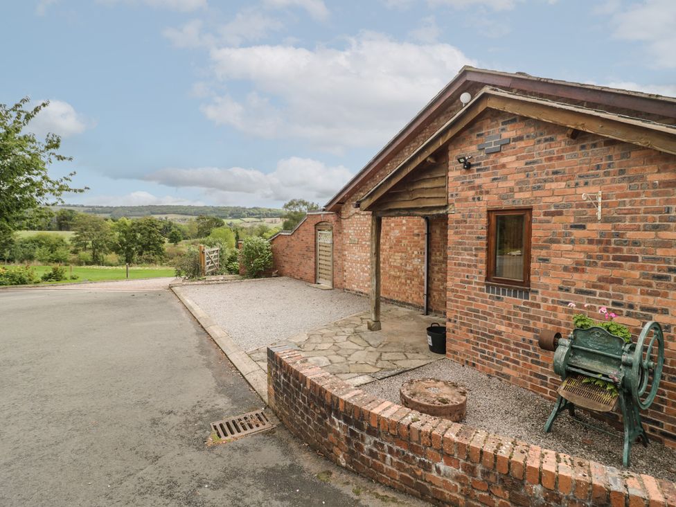 An outdoor view of a brick building with a gravel driveway at Pippin in Worcester