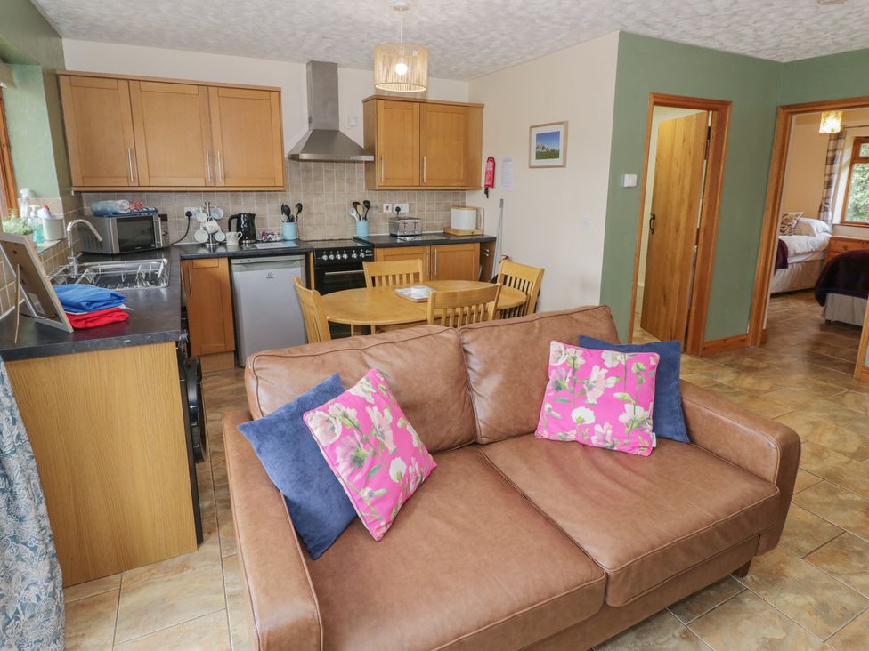 A kitchen with a dining table and appliances at Pippin in Worcester