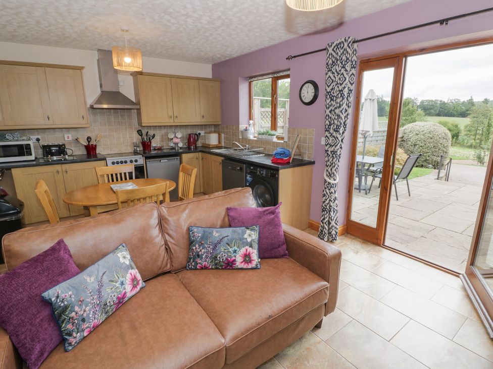 A kitchen with appliances and seating area at Russet in Worcester