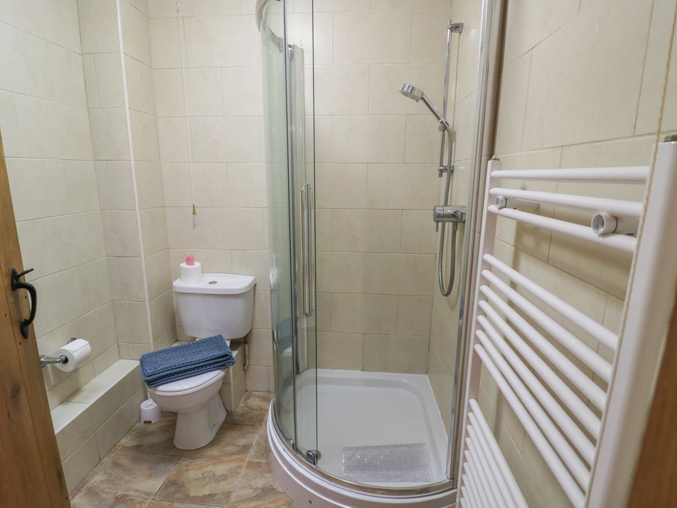 A bathroom with a shower and toilet at Russet in Worcester