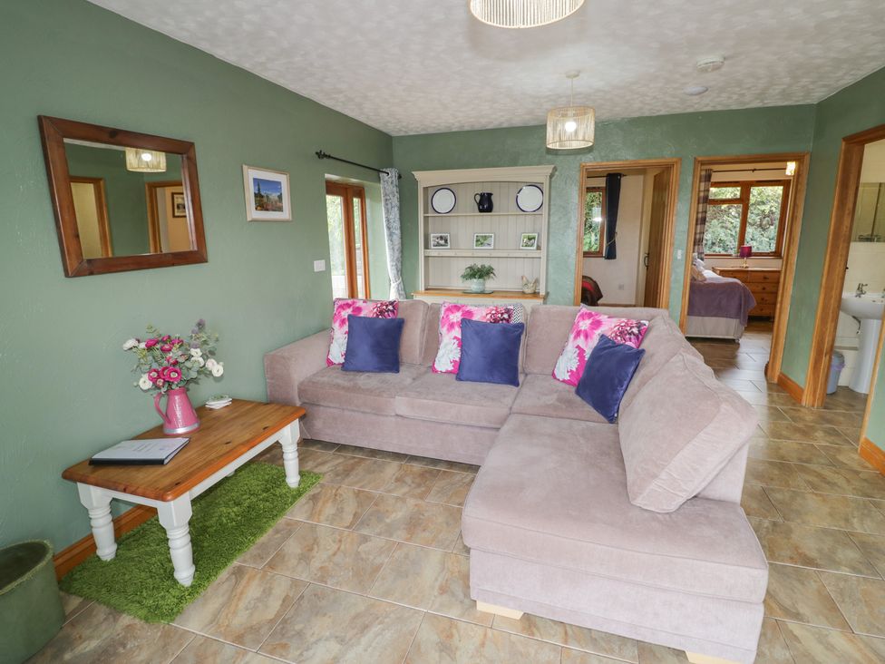 A living room with a sofa and table at Bramley in Worcester