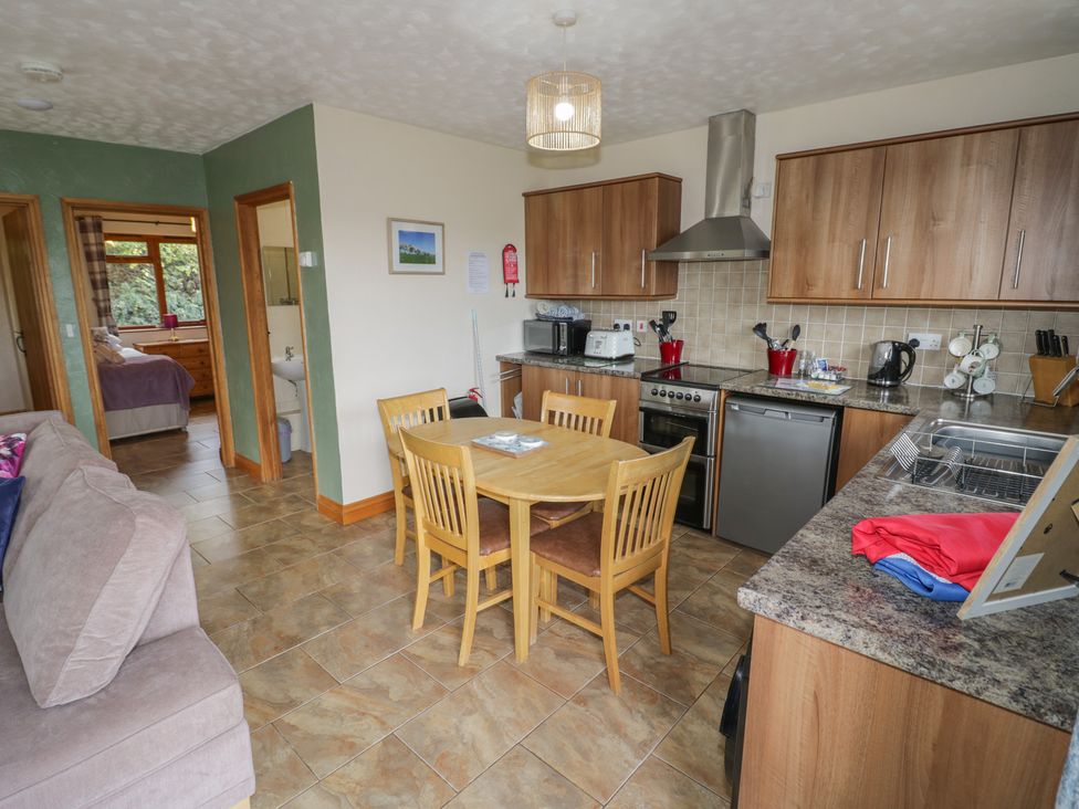 A kitchen with a table and chairs at Bramley in Worcester