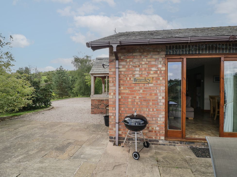 An outdoor area with a grill and brick wall at Bramley in Worcester