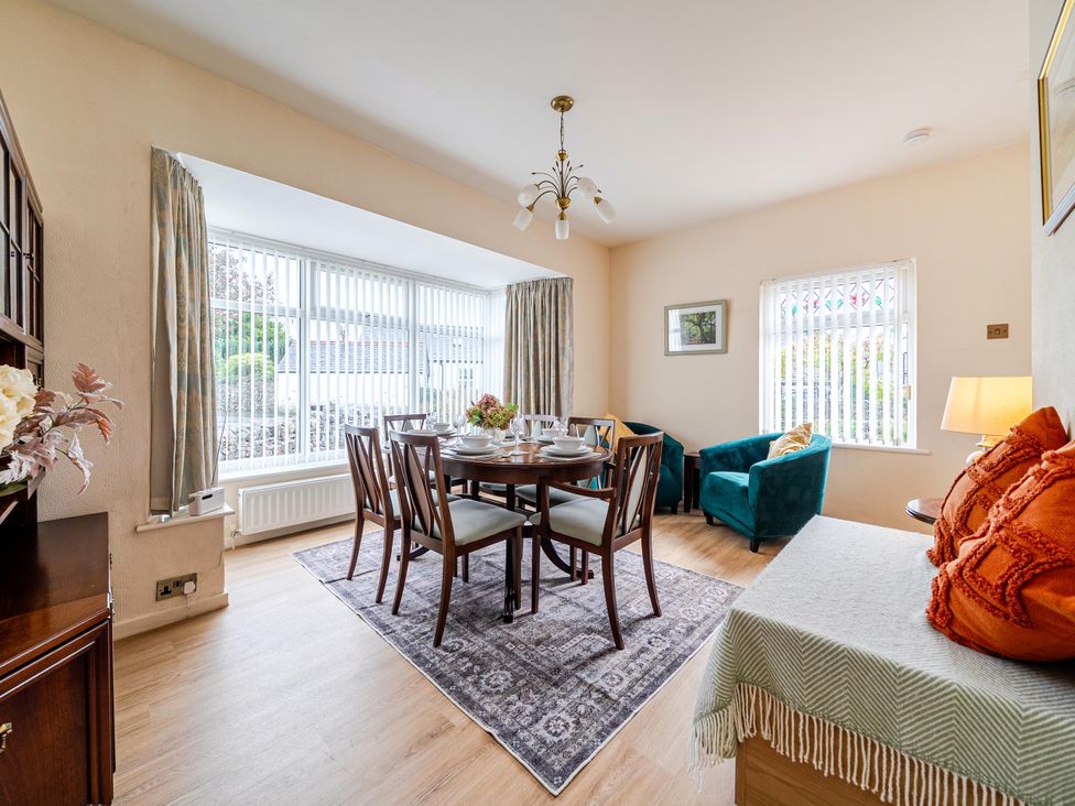 A dining room with a table and chairs at Waltergarth in Horton-In-Ribblesdale