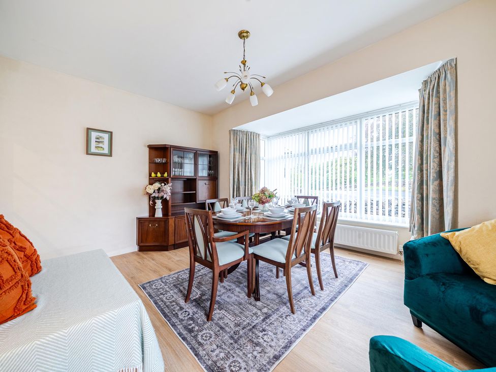 A dining room with a table and chairs at Waltergarth in Horton-In-Ribblesdale