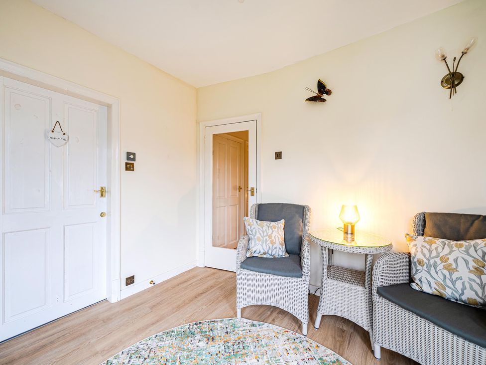A living room with seating and a side table at Waltergarth Horton-In-Ribblesdale