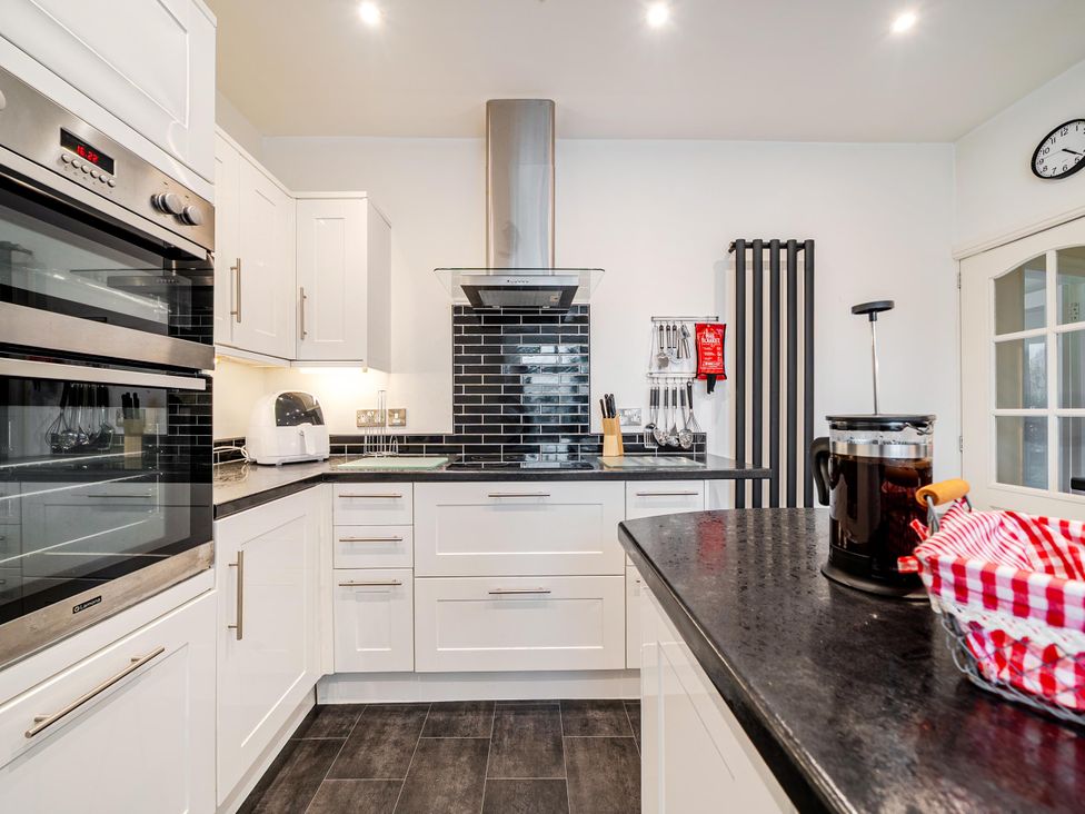 A kitchen with appliances and counter space at Waltergarth in Horton-In-Ribblesdale