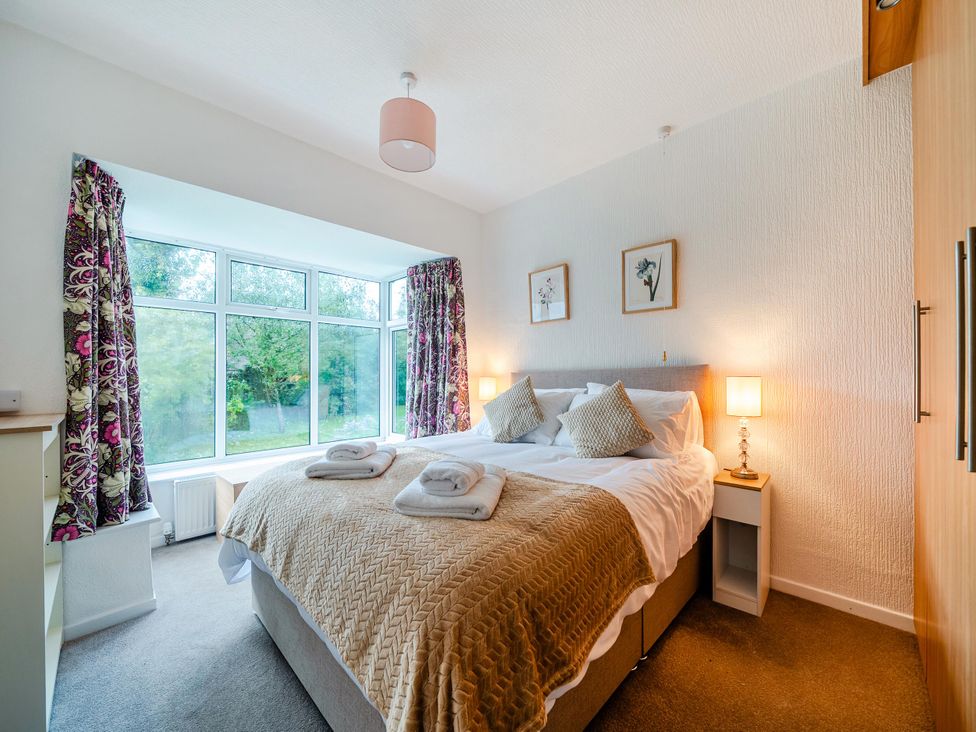 A bedroom with a bed and window at Waltergarth Horton-In-Ribblesdale