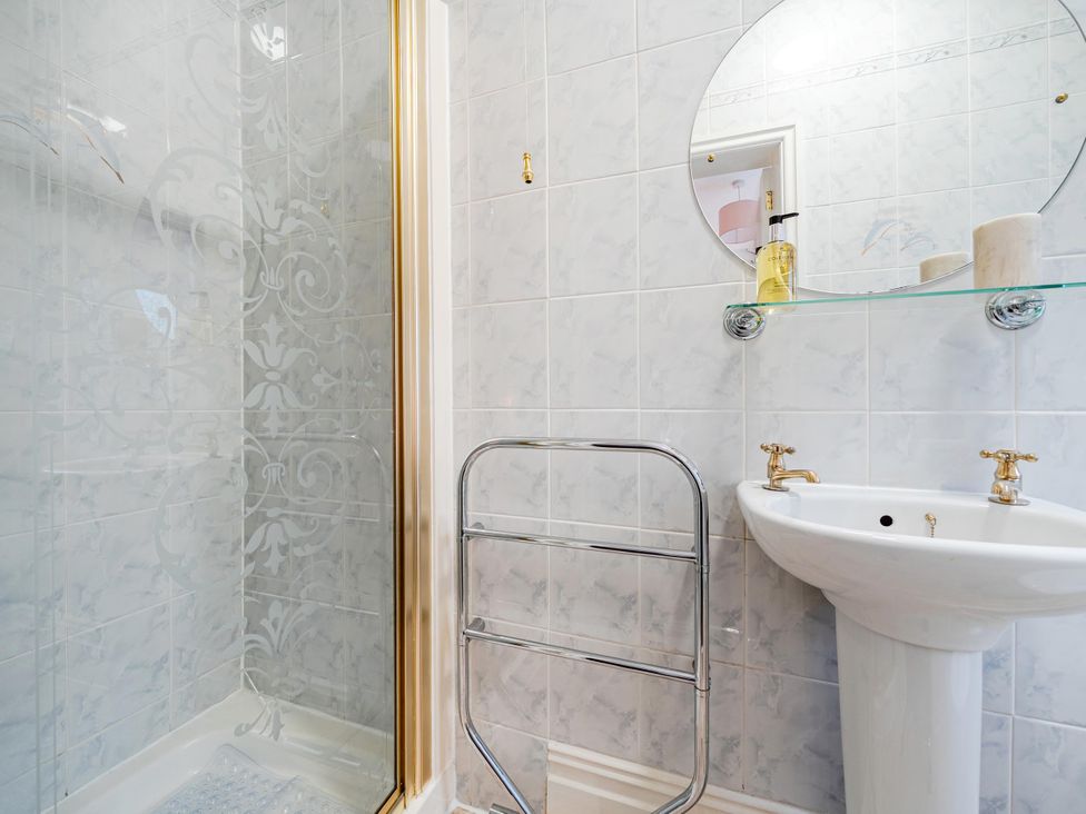 A bathroom with a shower and sink at Waltergarth Horton-In-Ribblesdale