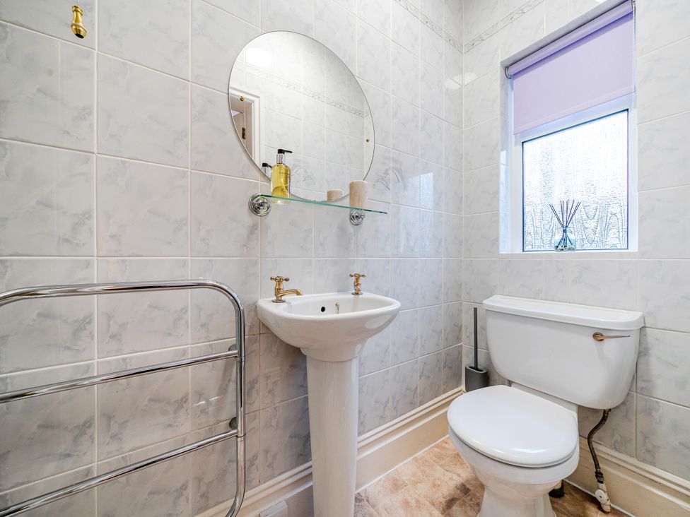 A bathroom with a sink and toilet at Waltergarth in Horton-In-Ribblesdale
