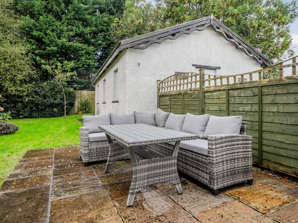A garden with a sofa and table at Waltergarth Horton-In-Ribblesdale
