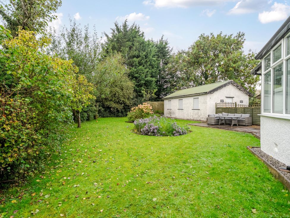 A garden with trees and a shed at Waltergarth in Horton-In-Ribblesdale