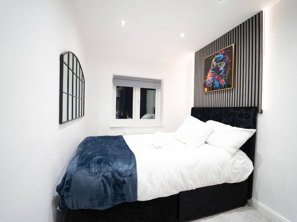 A bedroom with a bed and a window at 29 Batchworth Lane Northwood, Hertfordshire