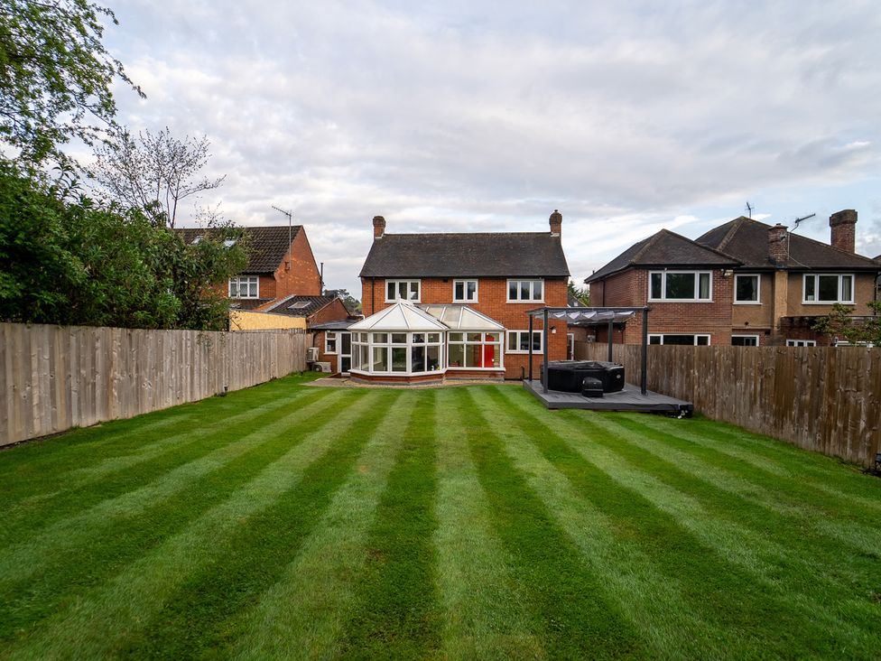A garden with a house and conservatory at 29 Batchworth Lane Northwood, Hertfordshire
