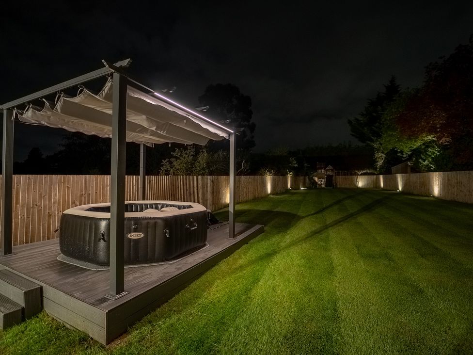 A garden with a hot tub and deck at 29 Batchworth Lane Northwood, Hertfordshire