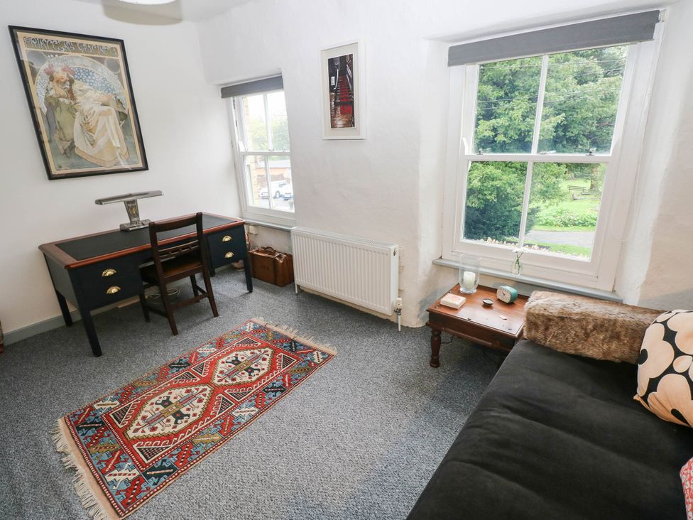 A living room with a desk and sofa at 11 Church Street Narberth