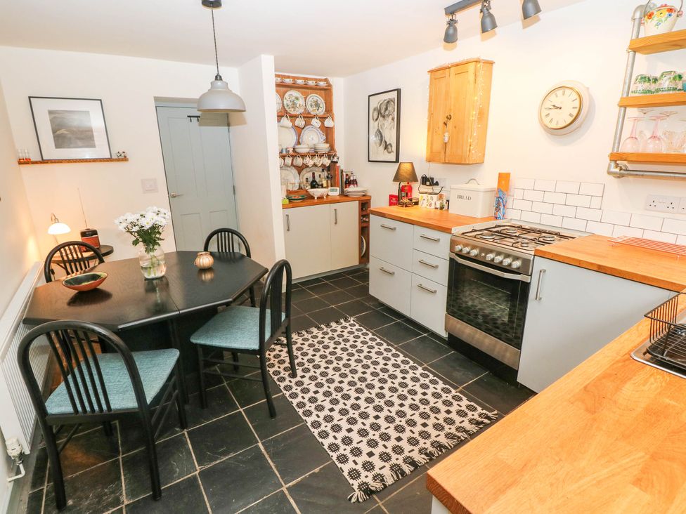 A kitchen with dining table and chairs at 11 Church Street Narberth