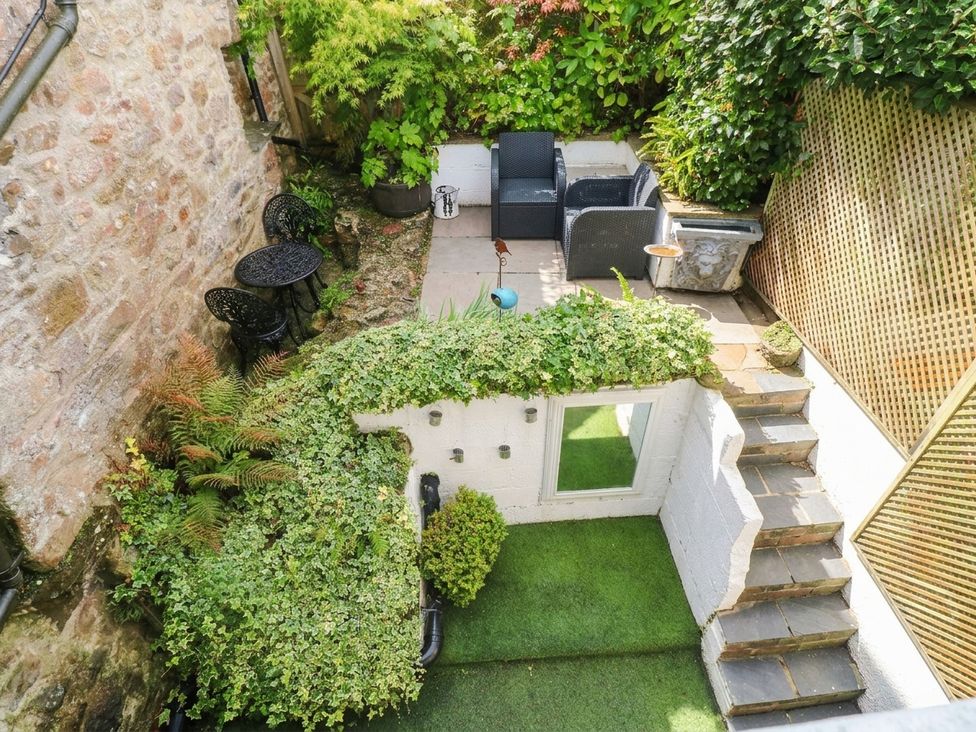 A garden area with patio furniture and greenery at 11 Church Street in Narberth