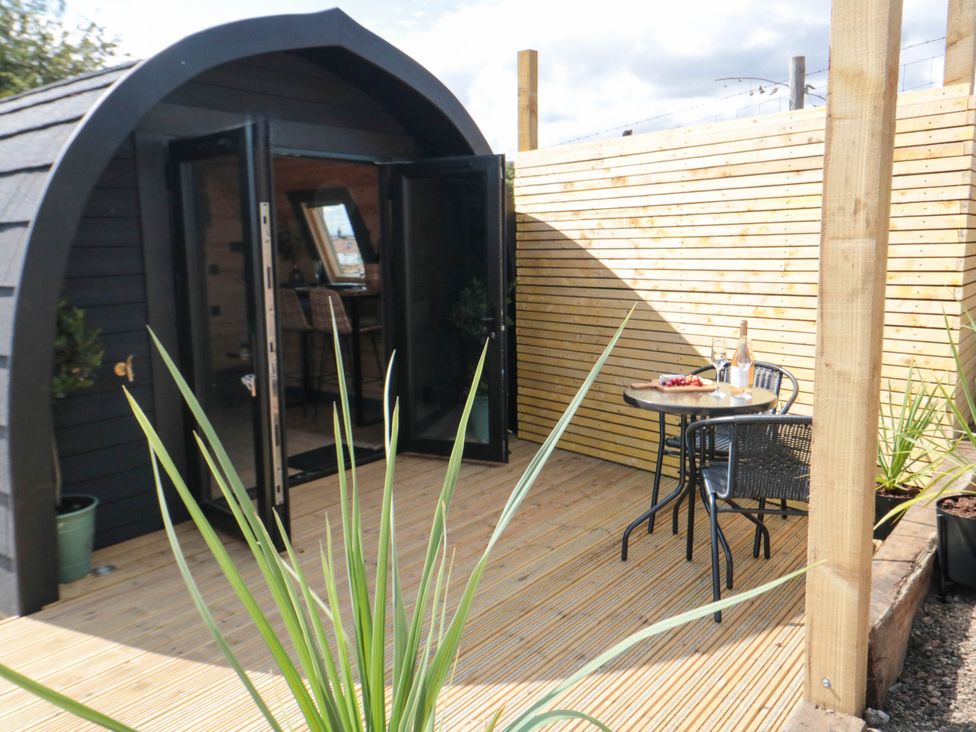 An outdoor area with a table and chairs at Windy Ridge Lodge in Egton