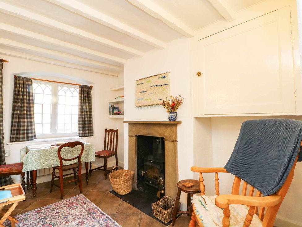 A living room with a table and chairs at 73 Ravensdale Cottages Cressbrook near Litton, Derbyshire