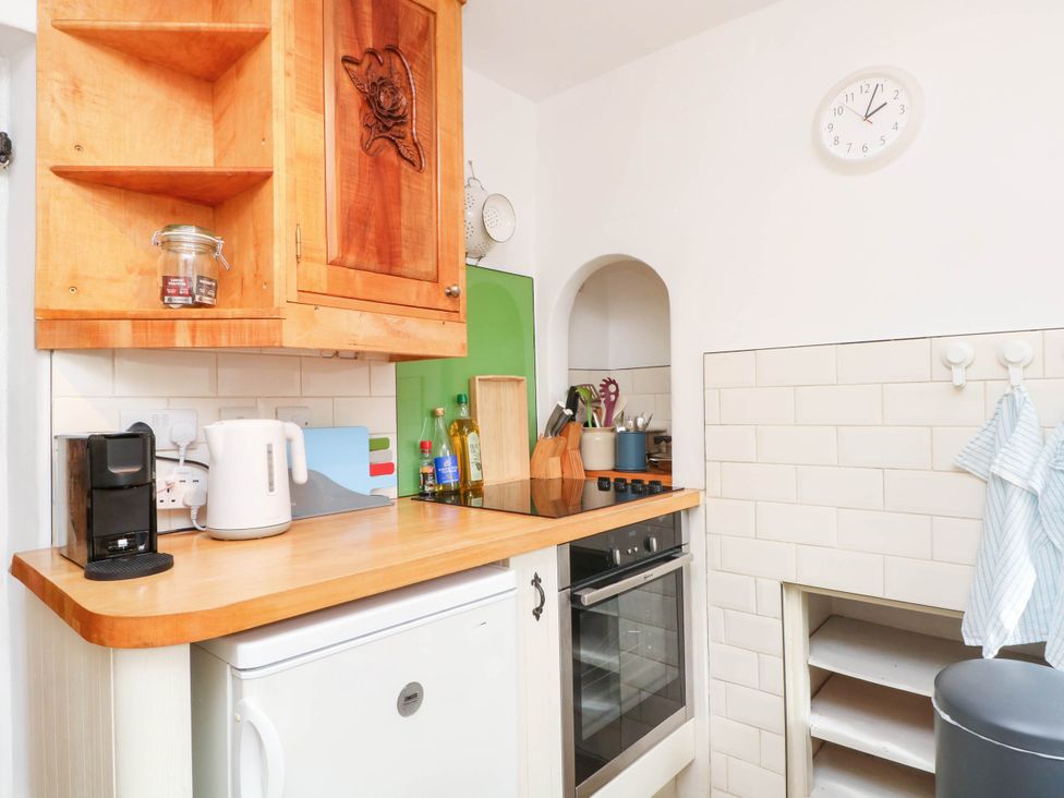 A kitchen with a kettle, toaster, and oven at 73 Ravensdale Cottages Cressbrook near Litton, Derbyshire