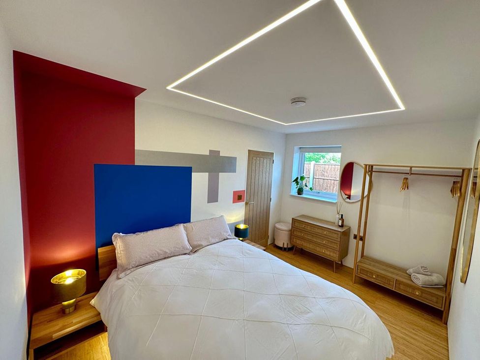 A bedroom with a bed and dresser at Luxurious guest house in Yorkshire with parking, Hemingbrough, Yorkshire