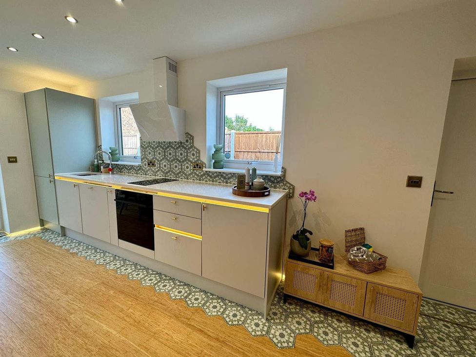 A kitchen with cabinets and a sink at the Luxurious guest house in Yorkshire with parking, Hemingbrough, Yorkshire