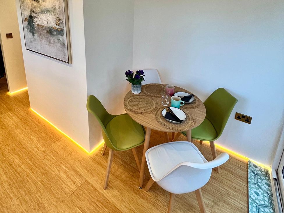 A dining area with a table and chairs at a luxurious guest house in Yorkshire with parking, Hemingbrough, Yorkshire