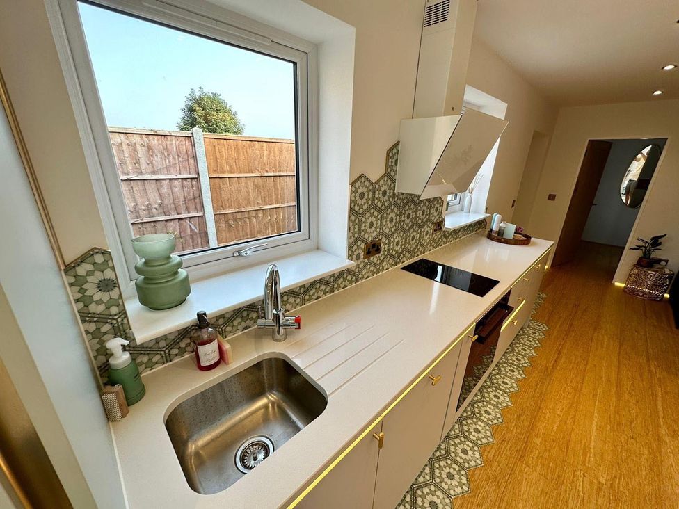 A kitchen with a sink and stove at Luxurious guest house in Yorkshire with parking, Hemingbrough, Yorkshire
