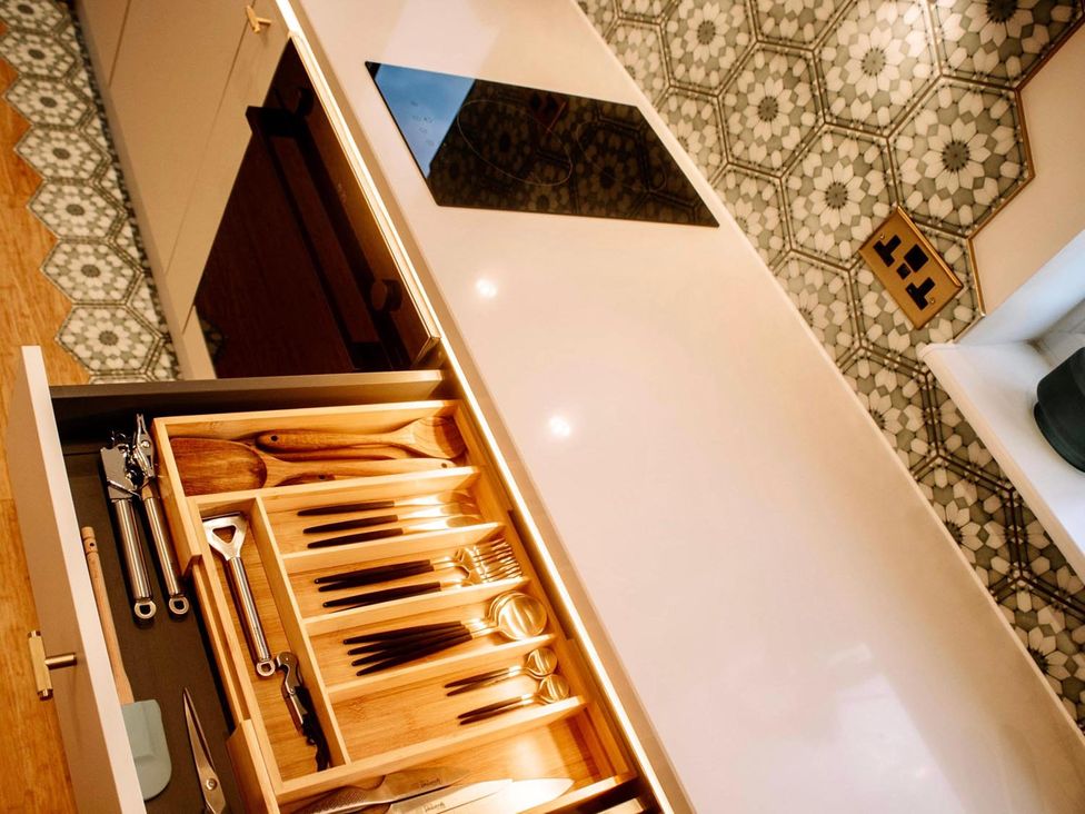 A kitchen with cutlery in a drawer and countertop at Luxurious guest house in Yorkshire with parking, Hemingbrough, Yorkshire