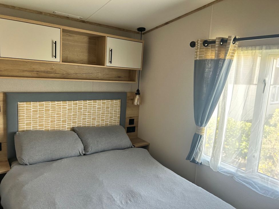 A bedroom with a bed and window at 