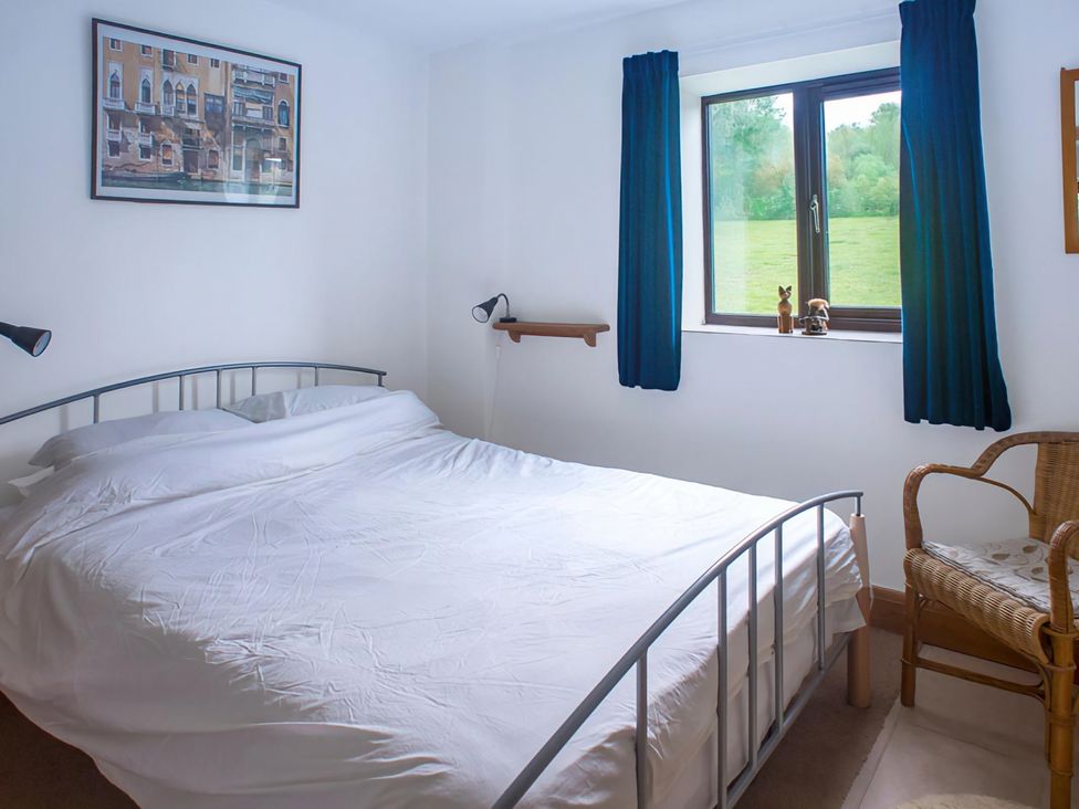 A bedroom with a bed and wall art at Accessible 4-Bed Barn, Sleeps 8 - Farm Stay near Mayfield