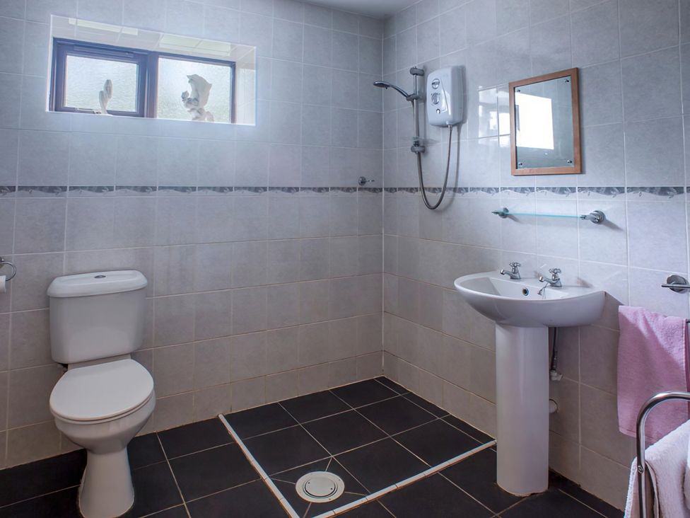 A bathroom with a toilet, sink, and shower at Accessible 4-Bed Barn, Sleeps 8 - Farm Stay near Mayfield