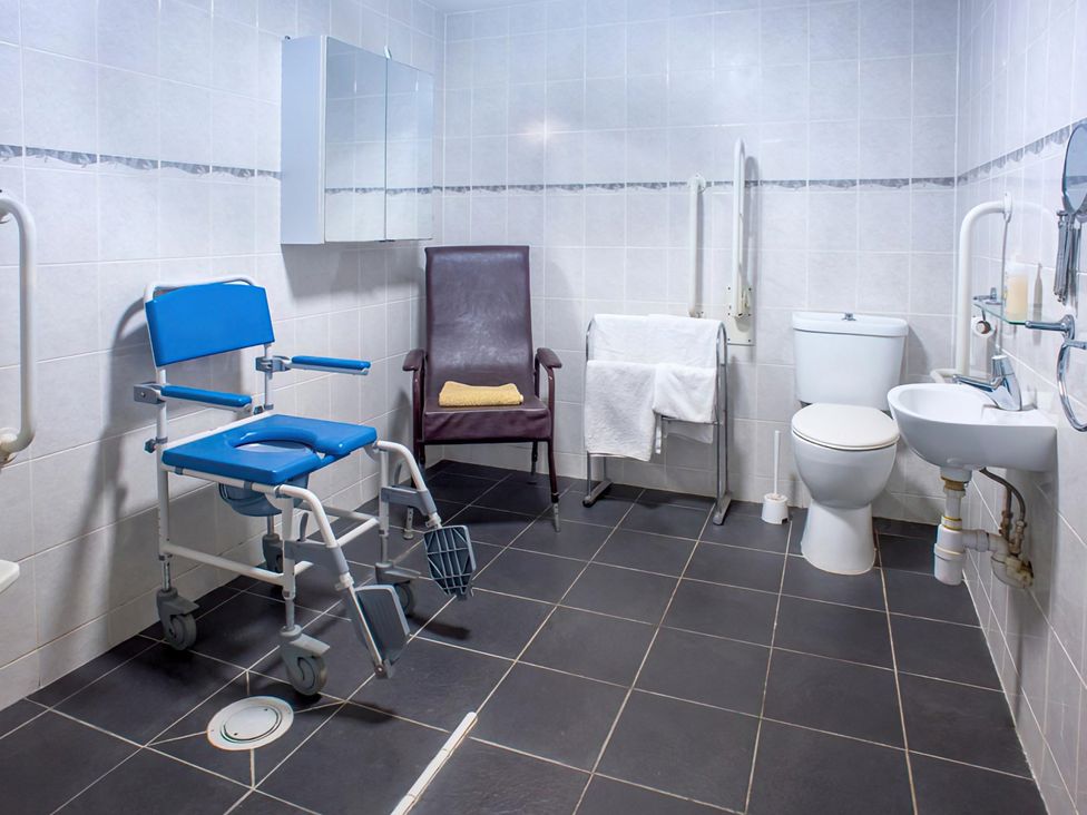 A bathroom with a toilet and sink at Accessible 4-Bed Barn, Sleeps 8 - Farm Stay near Mayfield