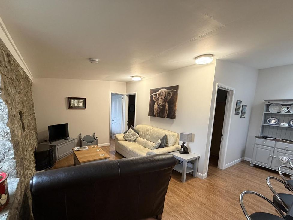 A living room with a sofa and television at Vale of Glamorgan - Cottage - Sleeps 4 - Parking, Llancarfan near St Athan