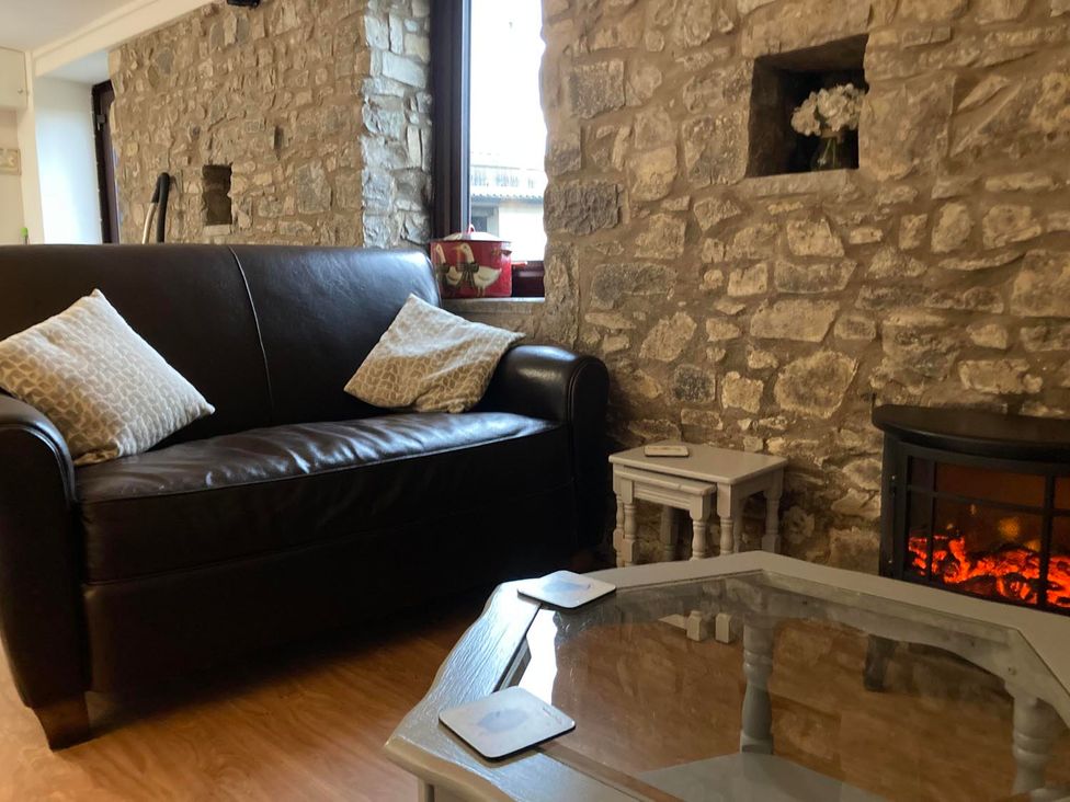 A living room with a sofa and a coffee table at Vale of Glamorgan - Cottage - Sleeps 4 - Parking, Llancarfan near St Athan
