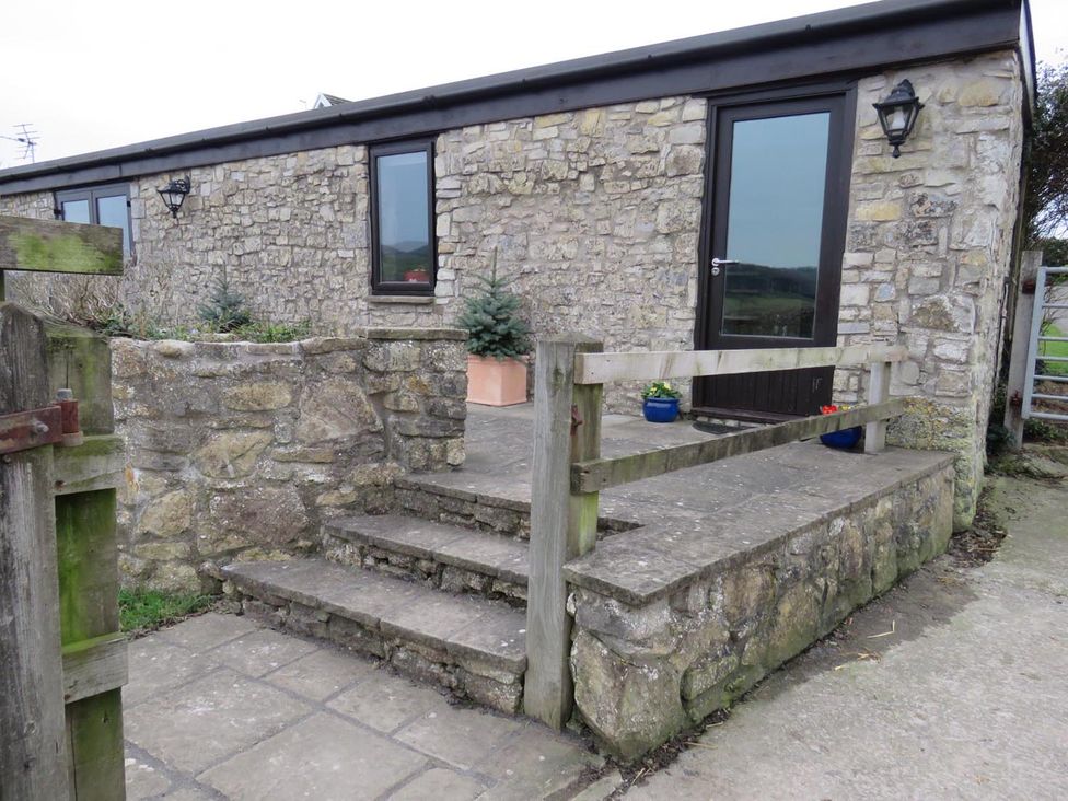 An outdoor area with stone steps and a door at Vale of Glamorgan - Cottage - Sleeps 4 - Parking in Llancarfan near St Athan