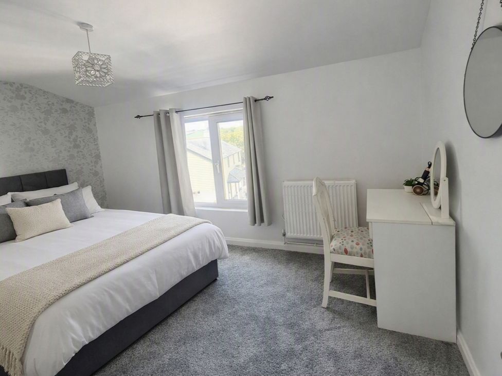 A bedroom with a bed and desk at Stylish Cornish Retreat, Sleeps 4 Near Hayle Beach, Hayle
