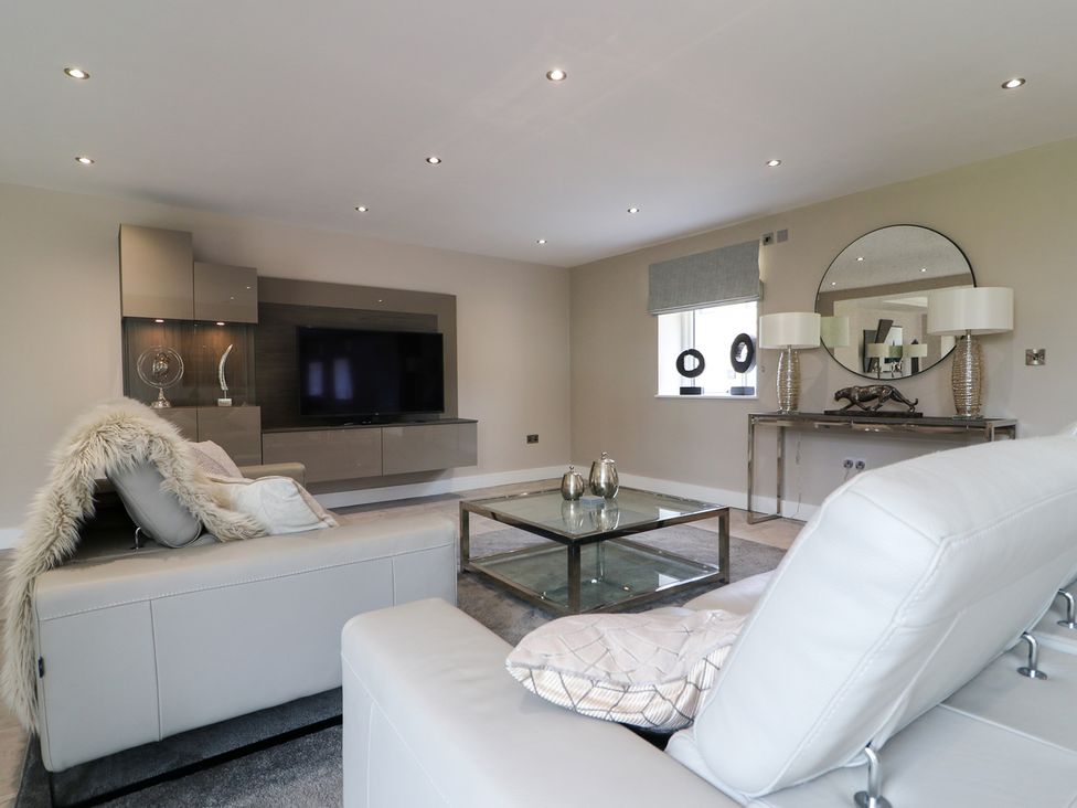 A living room with a television and sofa at Northumberland Luxury Stays - The Chivits near West Chevington