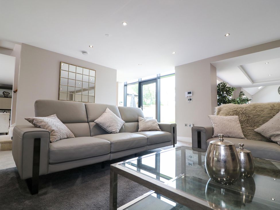 A living room with a sofa and coffee table at Northumberland Luxury Stays - The Chivits West Chevington near Amble