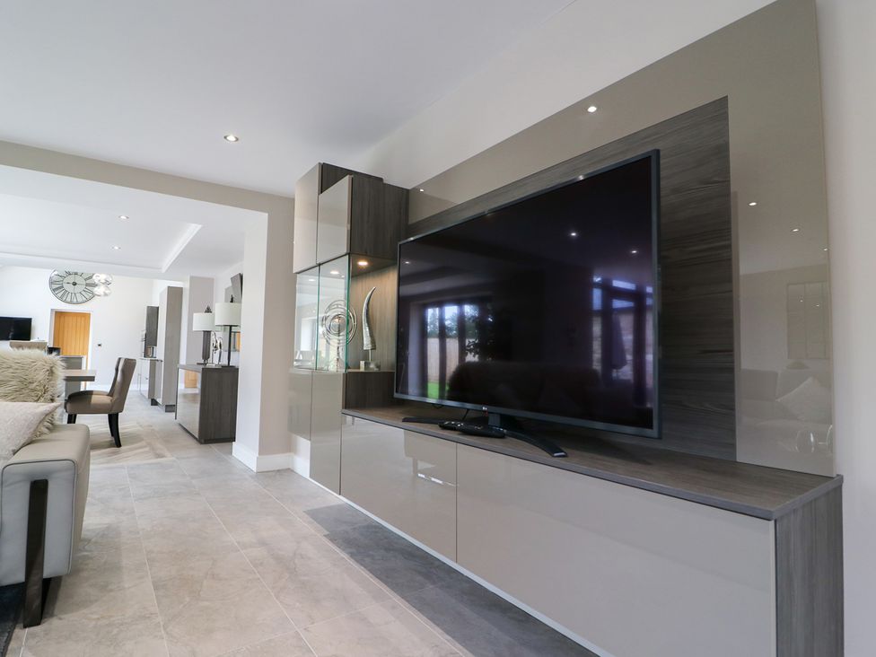 A living room with a television and a sofa at Northumberland Luxury Stays - The Chivits near West Chevington